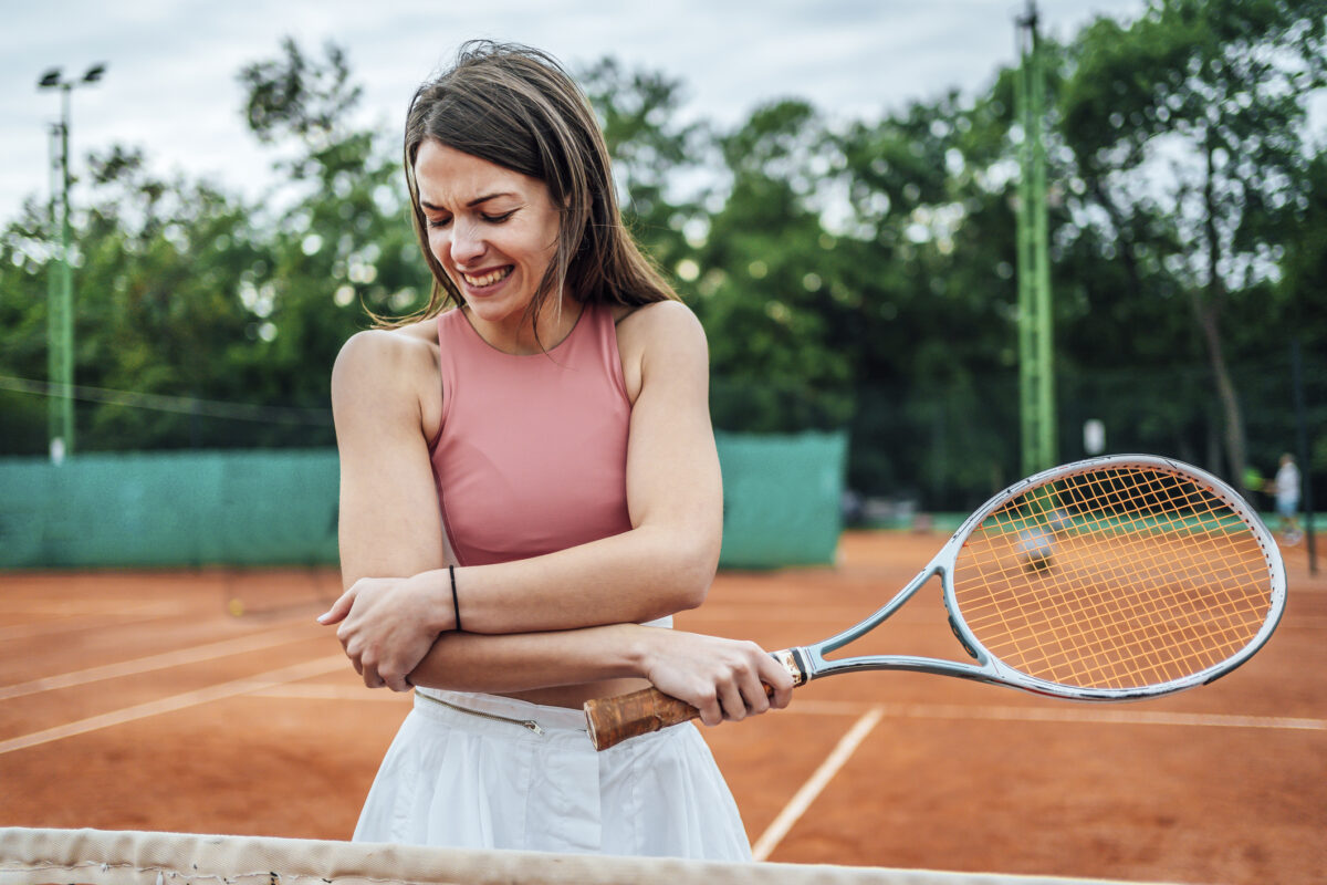 Woman who hurt her elbow while playing tennis